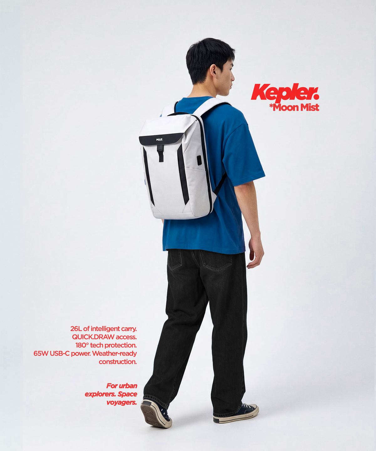 A man modelling a white Mule Kepler backpack with black accents, styled with a blue T-shirt, against a light grey studio background.