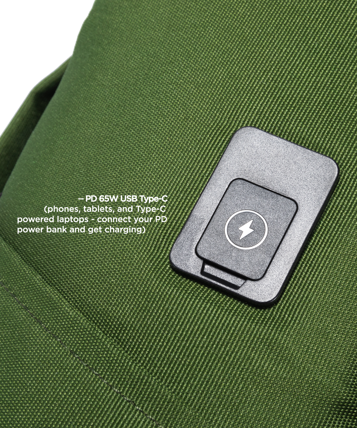 Close-up of a green fabric bag with a USB C Port attached with a white lightning bolt symbol and red text explaining USB-C charging compatibility.